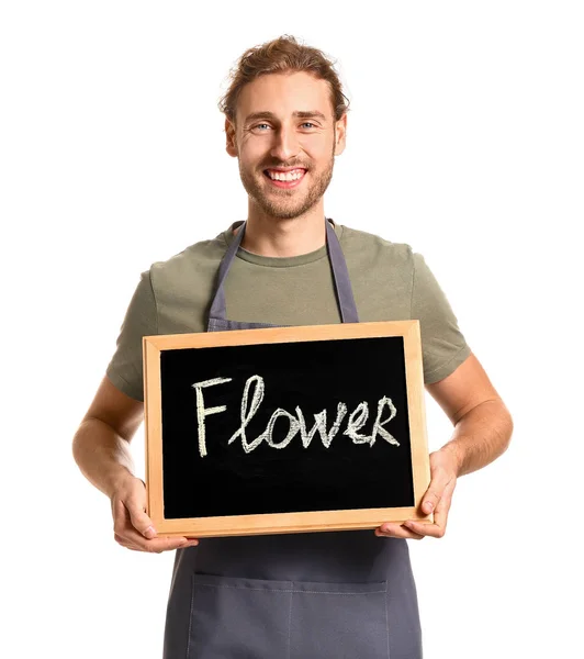 Portrait of male florist holding chalkboard with word FLOWER on white background — Stock Photo, Image