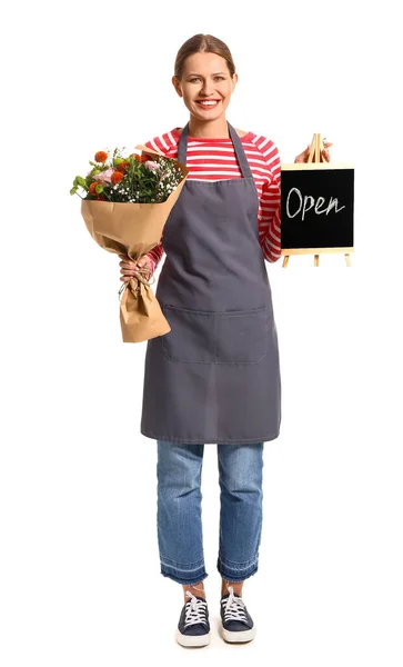 Female florist holding chalkboard with text OPEN and bouquet on white background — Stock Photo, Image