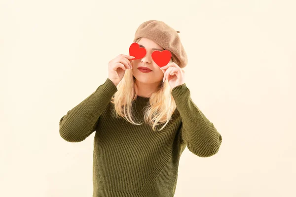 Beautiful young woman with small red hearts on color background — Stock Photo, Image