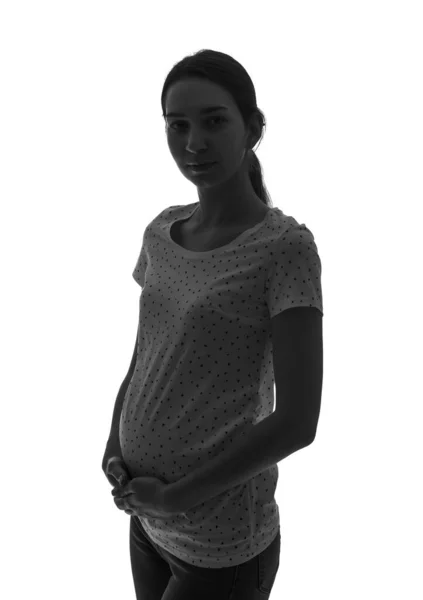 Silhouette av vakker, gravid kvinne på hvit bakgrunn – stockfoto