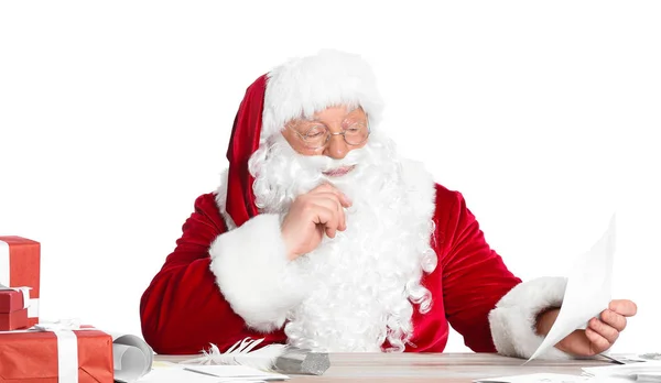 Santa Claus reading letters on white background — Stock Photo, Image