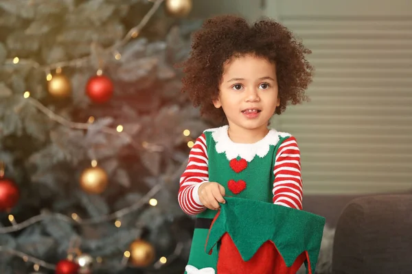 Little girl in costume of elf at home on Christmas eve — Stock Photo, Image