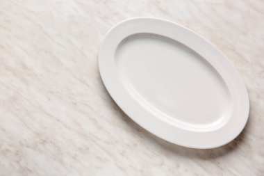 Empty plate on light background