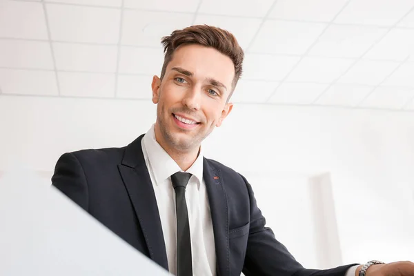 Handsome young businessman working in modern office — Stock Photo, Image