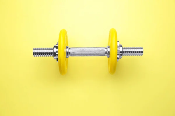 New dumbbell on color background — Stock Photo, Image