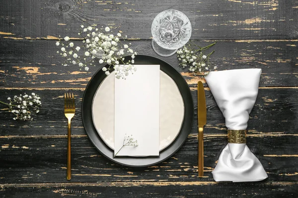 Beautiful table setting with empty menu on dark wooden background — Stock Photo, Image