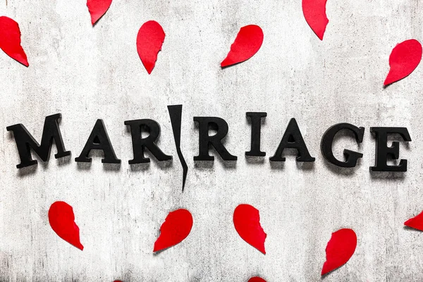 Word MARRIAGE with crack and broken hearts on grey background. Concept of divorce — Stock Photo, Image