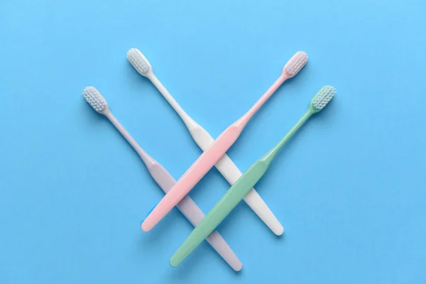 Tooth brushes on color background — Stock Photo, Image