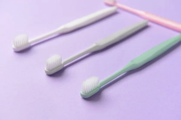 Tooth brushes on color background — Stock Photo, Image