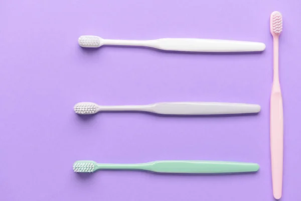 Tooth brushes on color background — Stock Photo, Image