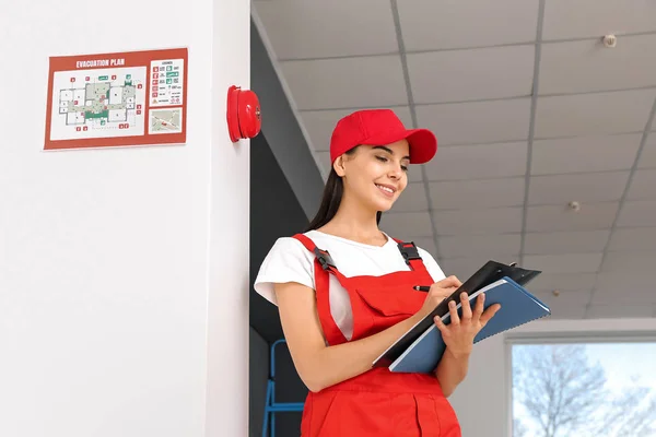 Fire safety specialist inspecting building