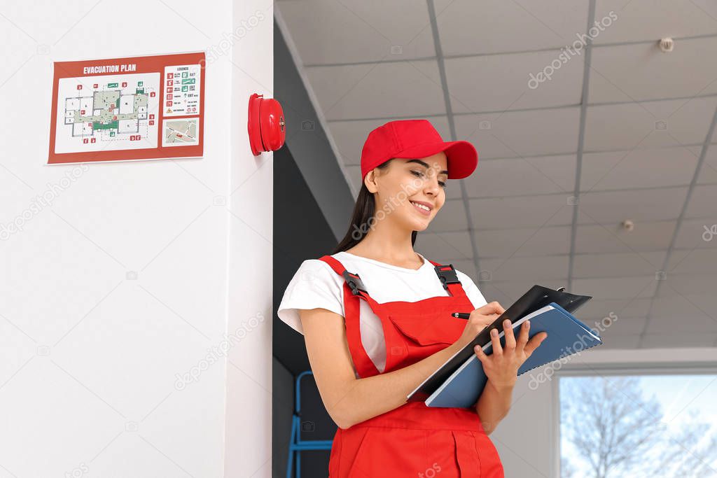 Fire safety specialist inspecting building