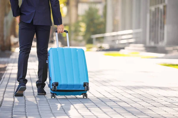 Young man with luggage for business trip outdoors — Stock Photo, Image