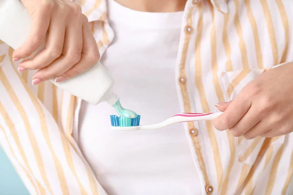 Young woman with toothbrush and paste, closeup — Stock Photo, Image