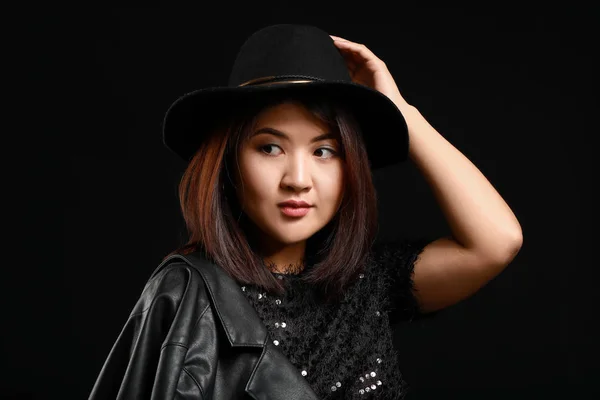 Portrait of young Asian woman on dark background — Stock Photo, Image