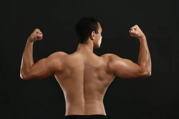 Sporty African-American man on dark background — Stock Photo, Image