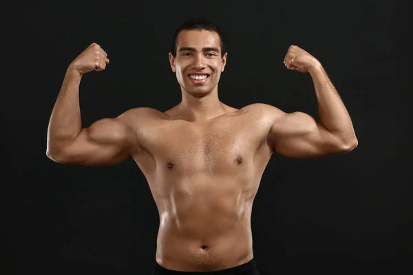 Sporty African-American man on dark background — Stock Photo, Image