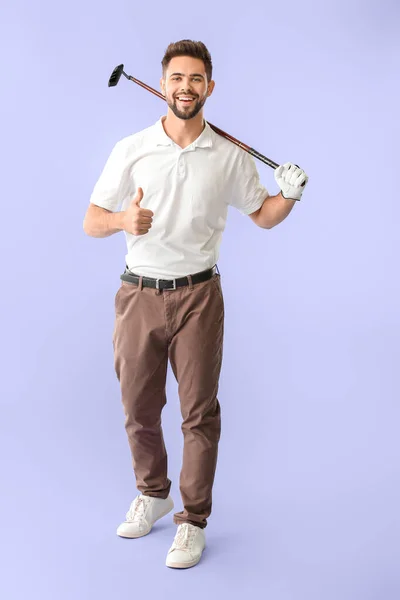 Handsome male golfer showing thumb-up on color background — Stock Photo, Image