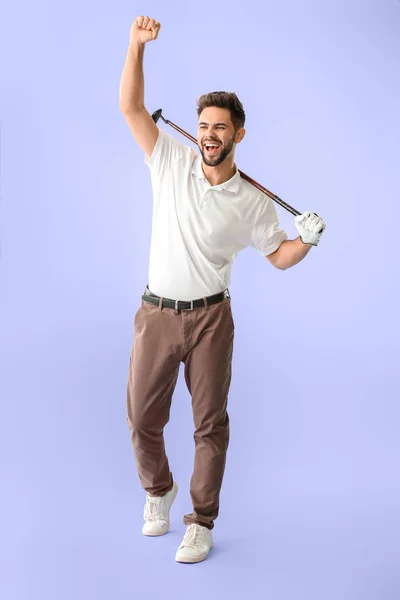 Handsome happy male golfer on color background — Stock Photo, Image
