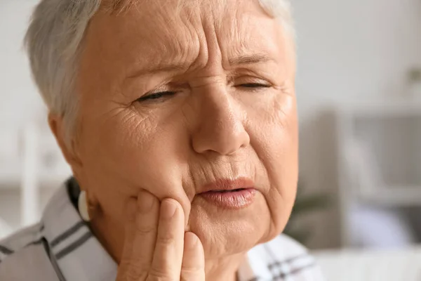 Senior woman suffering from toothache at home — Stock Photo, Image