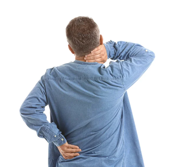 Idős férfi szenved hátfájás fehér háttér — Stock Fotó