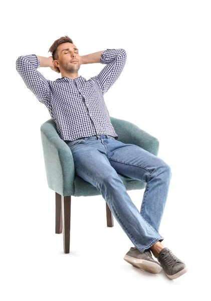 Handsome man sitting in armchair on white background — Stock Photo, Image