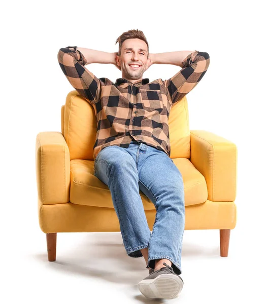 Handsome man sitting in armchair on white background — 스톡 사진