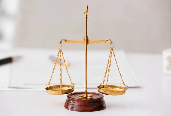 Scales of justice on lawyer's workplace — ストック写真