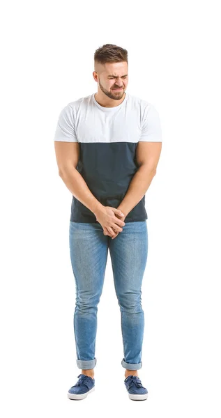 Młody człowiek z chorobą urologiczną na białym tle — Zdjęcie stockowe