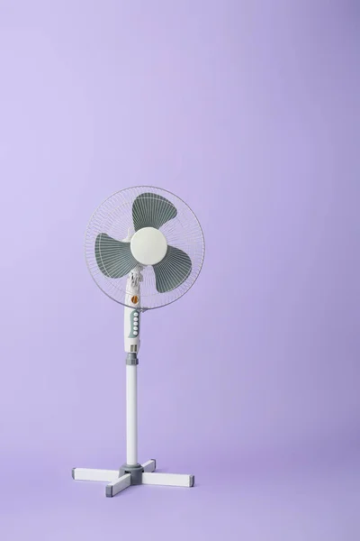 Electric fan on color background — ストック写真