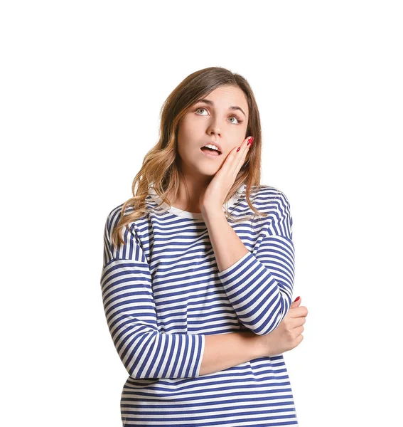 Mujer joven reflexiva sobre fondo blanco —  Fotos de Stock