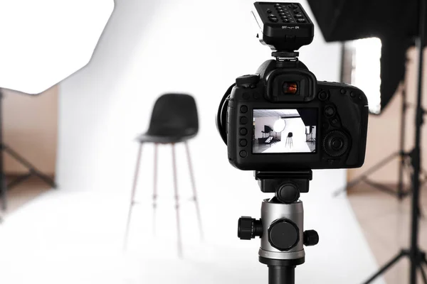 Modern photo camera in professional studio — ストック写真