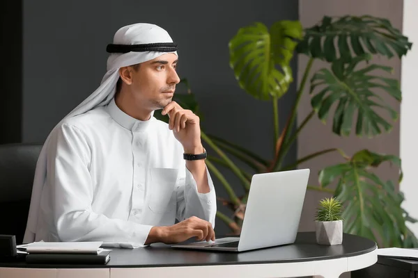 Arab businessman working in office