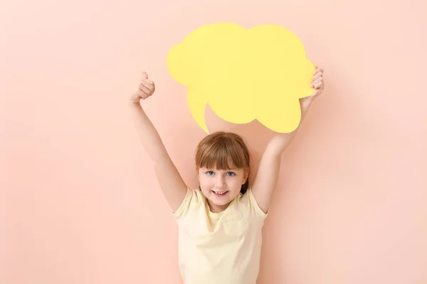 Cute little girl with blank speech bubble on color background — 스톡 사진