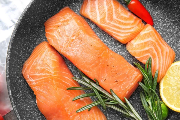 Raw salmon fillet on frying pan — 스톡 사진