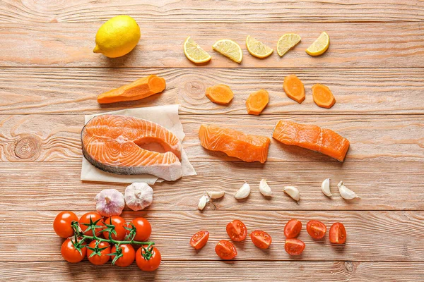 Composition with fresh raw salmon on table — Stock Photo, Image