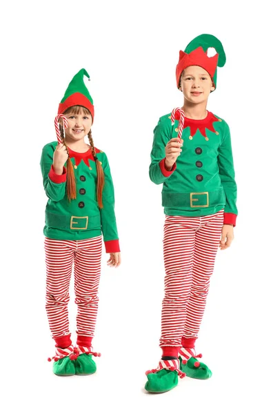 Маленькі діти в костюмі ельфа і з цукерками на білому тлі — стокове фото