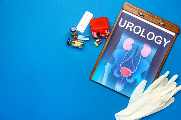Papírový list s obrázkem urogenitálního systému, léky a rukavice na barevném pozadí — Stock fotografie