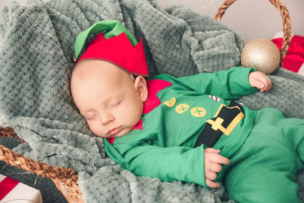 Little baby in costume of elf sleeping in basket — Stock Photo, Image