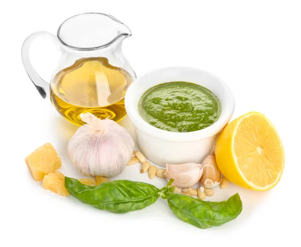 Pesto sauce with ingredients on white background — Stock Photo, Image