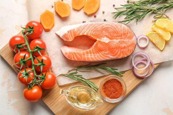 Fresh raw salmon, vegetables and spices on table — Stock Photo, Image