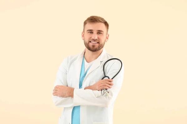 Portrait of male doctor with stethoscope on light background — 스톡 사진