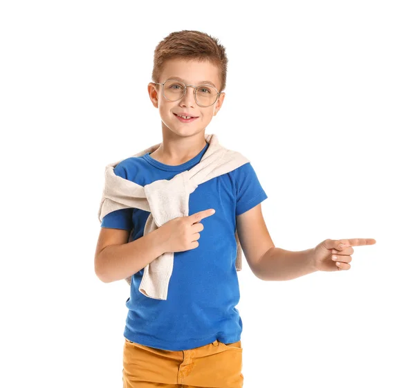 Cute fashionable boy pointing at something on white background — Stock Photo, Image