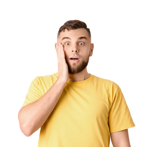 Surprised young man on white background — Stock Photo, Image