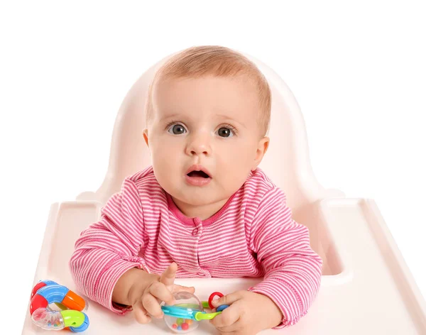 Portrait of cute little baby sitting in high-chair against white background — Stock Photo, Image
