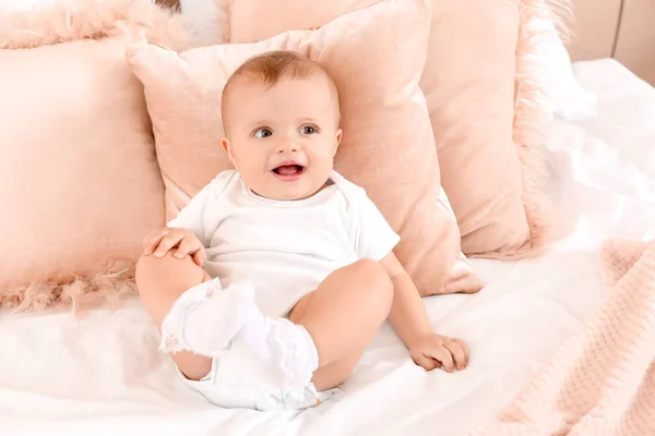 Portrait of cute little baby on bed at home — Stock Photo, Image