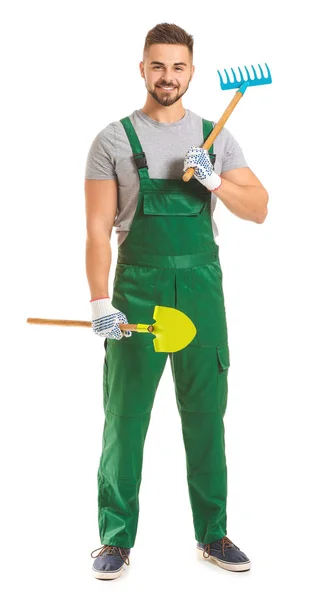 Bonito jardineiro masculino com ferramentas sobre fundo branco — Fotografia de Stock