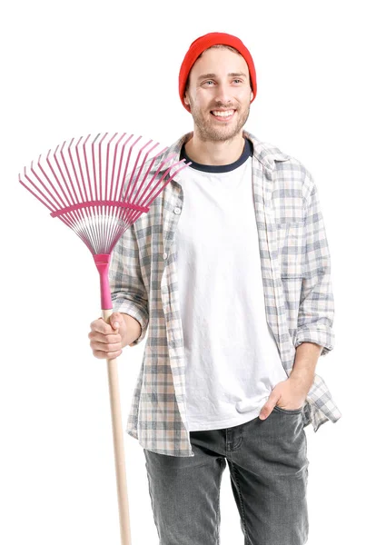 Hombre con rastrillo para limpieza de hojas de otoño sobre fondo blanco — Foto de Stock