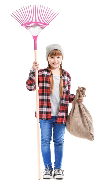 Little girl with rake for autumn leaves clean-up on white background — Stock Photo, Image