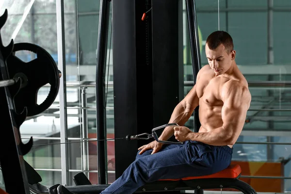 Sporty muscular man training in gym — 스톡 사진